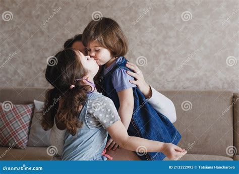 Two female fighters kiss each other on the mouth before their